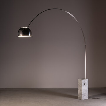 Arco floor lamp, designed by Achille Castiglioni, with stainless steel arch, aluminum shade and white marble base. Udine, Italy. February 5, 2025.
