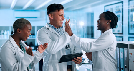 Fototapeta premium Science, high five and people on tablet in lab celebrate for results, breakthrough and medical success. Healthcare, pharmaceutical and men and women on tech excited for research, discovery and cure