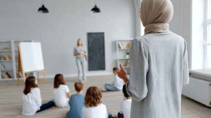 Obraz premium Standing tall, a poised Middle Eastern woman teaches eager children, embodying World Teacher's Day and International Day of Education
