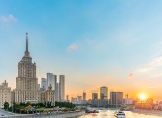 Obraz premium High-rise stalinist building near river at summer sunset in Moscow, Russia. Historic name is Hotel Ukraine.