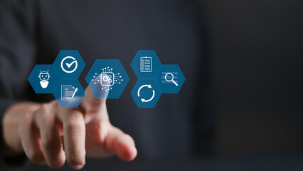 Automation concept. Business management with automation technology. Optimize business process workflow, robotic process automation or RPA. Person touching automation icon on virtual screen.