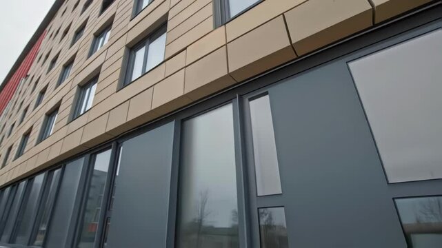 Closeup shot of adaptive modular blocks in a buildings fa&Atilde;&sect;ade showcasing their unique textures and colors along with tiny sensors that dynamically adjust their orientation to