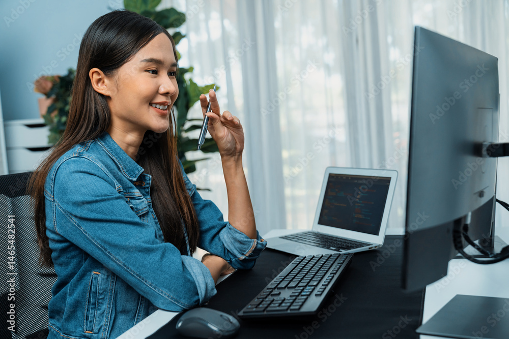Poster young asian it developer looking online information on pc for beautiful pose with coding program dat