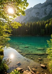 Shining sun starburst over a pristine alpine lake with clear turquoise water. Summer mountain landscape and forest. Beautiful nature park during golden hour.