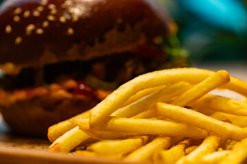 Closeup of hamburger and fries served at restaurant