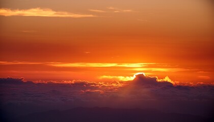 the sky is orange and the sun is setting