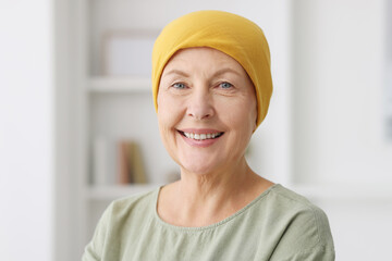 Portrait of senior woman with cancer at home