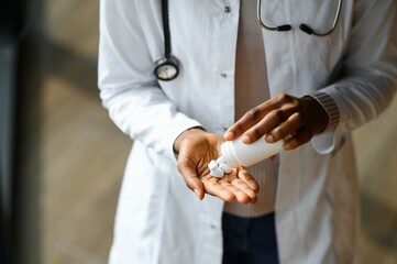 Close up of doctor's hands with pills. Healthcare concept
