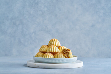 Traditional arabic eid sweets. Maamoul or mamoul  semolina cookies with walnuts . Close up