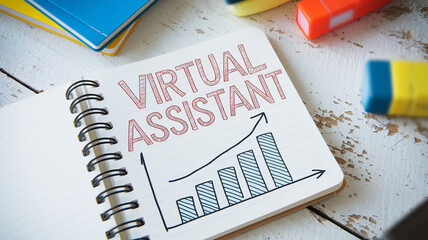 Notebook with hand-drawn text "Virtual Assistant" and upward graph, suggesting growth and success in virtual assistance services