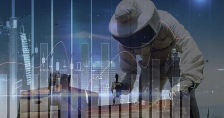 beekeeper wearing suit and gloves leaning over hive boxes on rooftop, with stock charts floating - Powered by Adobe