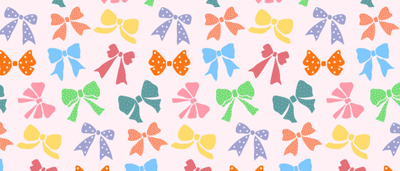 Seamless pattern with colored bows in pastel colors.