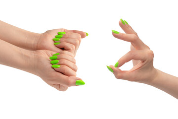 Hand of a woman with green naols hold some tiny or thin object.