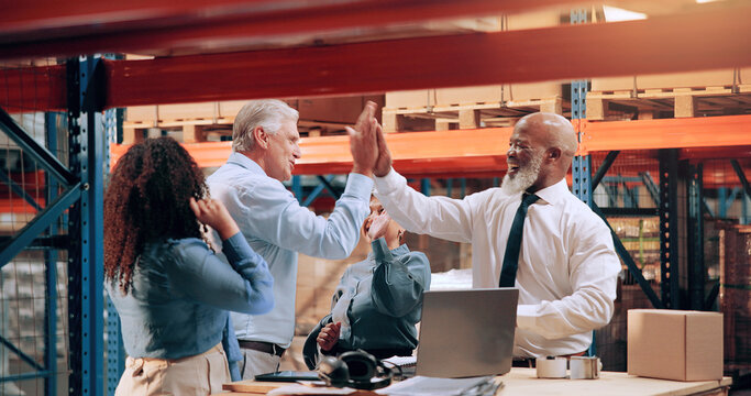 Team, excited and high five in warehouse for logistics, business and feedback on laptop. People, tech or happy in storage for supply chain win, new export agreement and sales record for distribution