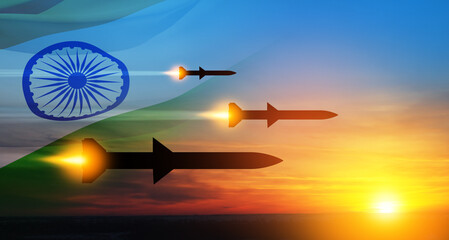 Fired missiles fly to the target. Missiles at the sky at sunset with Indian flag. Missile defense,...