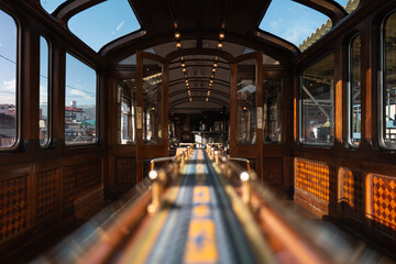 Elegant interior of the Titicaca Train on the scenic route from Cusco to Puno, featuring vintage decor and panoramic windows.