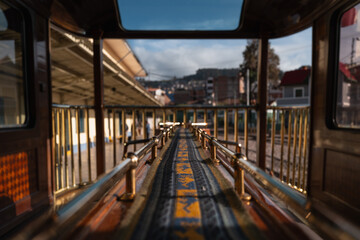 Elegant interior of the Titicaca Train on the scenic route from Cusco to Puno, featuring vintage decor and panoramic windows.