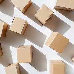 Cardboard shipping boxes scattered on a white background, flat lay composition symbolizing delivery, packaging, and logistics
