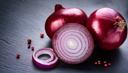red onions and quercetin on slate background