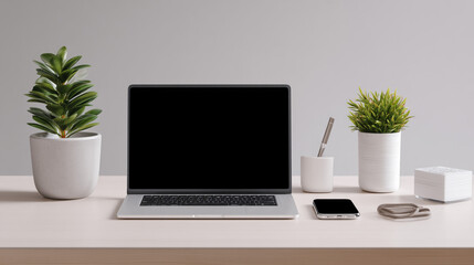 Fototapeta premium Laptop and accessories arranged on a modern desk, a perfect workspace scene for various uses.