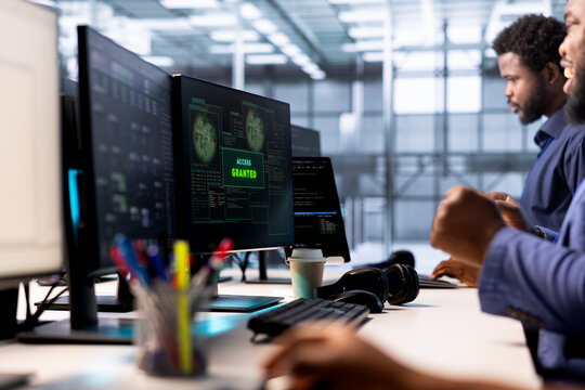 Developer receiving access granted notification while reconfiguring server farm, optimizing it. Worker ensures data center operates efficiently, happy after successfully eliminating all errors