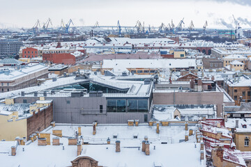 Old buildings roofs under the snow. Saint Petersburg.