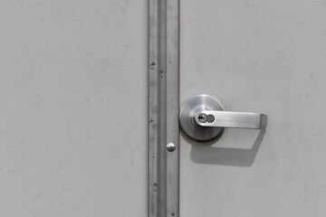 Stainless steel industrial doorknob on exterior doors. 