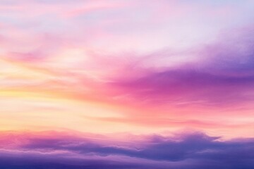 Fototapeta premium Vibrant and colorful sky during sunset with soft pink, purple, yellow, and orange clouds creating a peaceful and serene atmosphere