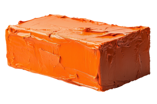 Bright orange block of sculpting material on a transparent background ready for creative projects and artistic endeavors at home or in the studio