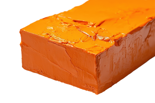 Bright orange block of sculpting material on a transparent background ready for creative projects and artistic endeavors at home or in the studio