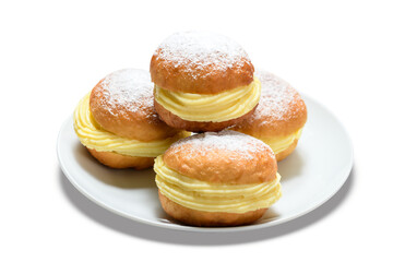 Delicious bakery dreams with creamy filling and powdered sugar on a white plate