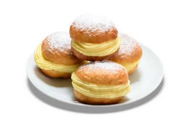 Delicious bakery dreams with creamy filling and powdered sugar on a white plate