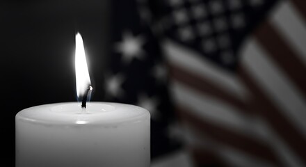 Candle Burning Brightly in Remembrance with Flag