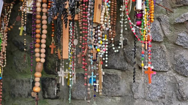 Prayer Rosaries Hanging in Our Lady Virgin Mary Outdoor Place of Worship Cavern
