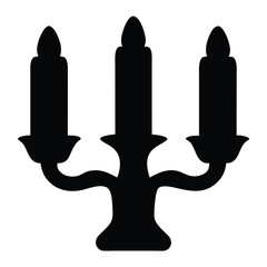 Obraz premium Silhouette of an Elegant Candelabra with Three Unlit Candles on White Background