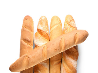 Many fresh baguettes on white background