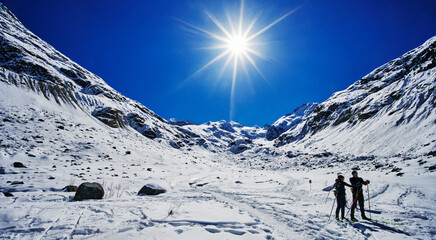 skiiers heading to Morteratsch Glacier Ice Caves, Switzerland, Europe 