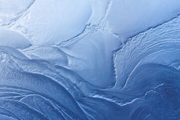 Close-up of textured blue ice surface.