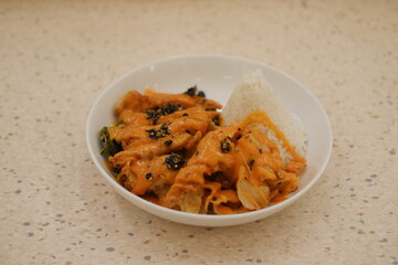 Delicious Chicken Dish with Orange Curry and Rice