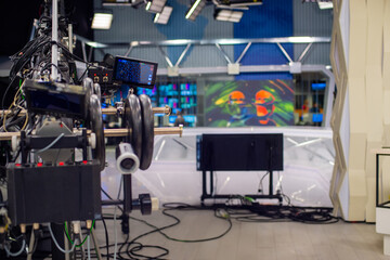 abstract blurred background with interior of TV studio .empty TV studio with filming and lighting equipment