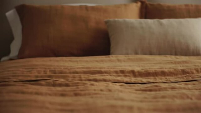 Close-up of rumpled linen bedding in earth tones