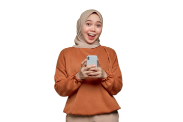 Shocked young Asian woman in orange shirt using mobile phone with open mouth, received good news isolated on transparent background