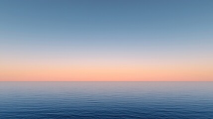 Fototapeta premium Calm ocean water meets a colorful horizon at sunset, blending blue and peach tones under a clear sky.