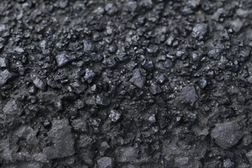 Fototapeta premium A Vast Expanse of Crushed Black Material Exhibiting Uniformity and Dense Composition