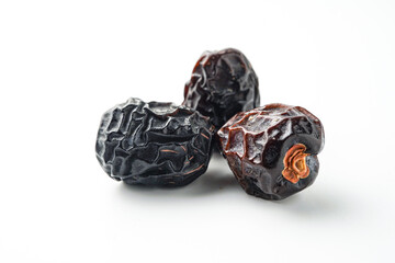 Dates fruit ajwa or kurma ajwa, isolated on white background