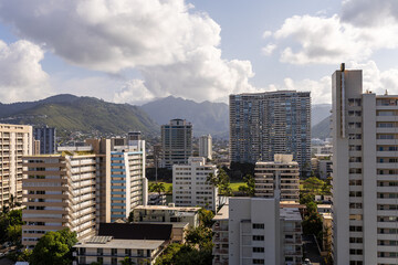 Urban Skyline with Mountains and Cloudy Sky in Honolulu, Hawaii