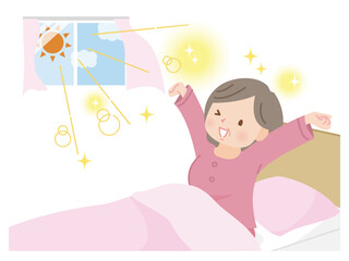 朝スッキリ目覚めて伸びをするミドル女性