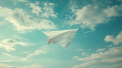 Fototapeta premium White paper airplane soaring through a vivid sky.