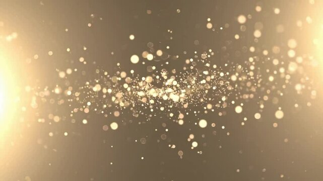 Golden glitter sparkles with glowing light effect for festive background