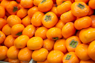 Top down view of group of persimmons. Backdrop, wallpaper background. Kyoto, Japan